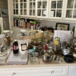 Kitchen countertop with messy arrangement of baking ingredients